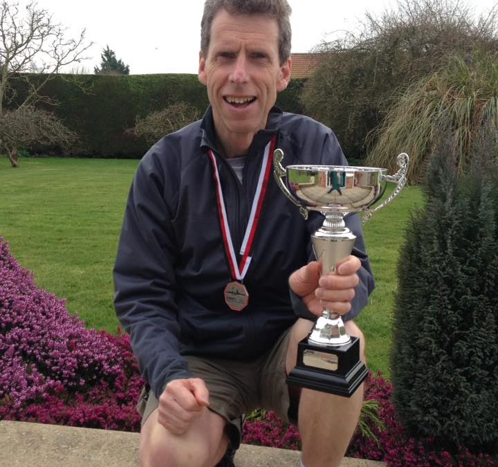 Chris Hollinshead with Half marathon winners trophy